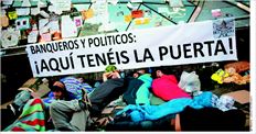 «Τραπεζίτες και πολιτικοί: εδώ είναι η έξοδος» γράφει ένα από τα πολλά πανό των «Αγανακτισµένων» στην Πουέρτα ντελ Σολ  